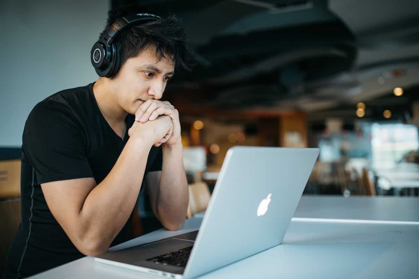 Young man on a computer- Virtual Outpatient Addiction Treatment